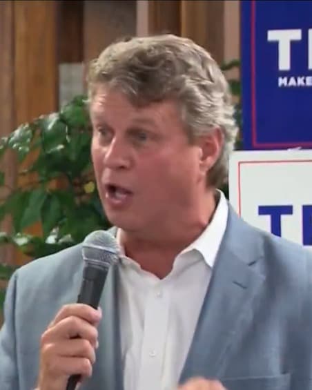 Bill Huizenga speaking into a microphone